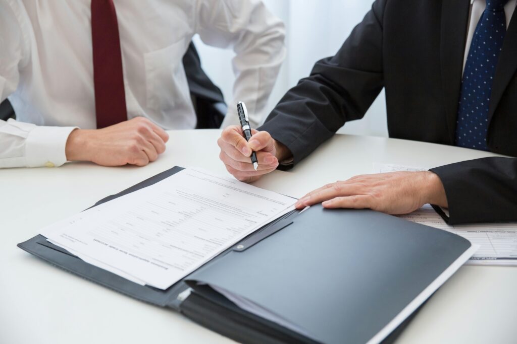 Lawyer explaining warranty documents to a person